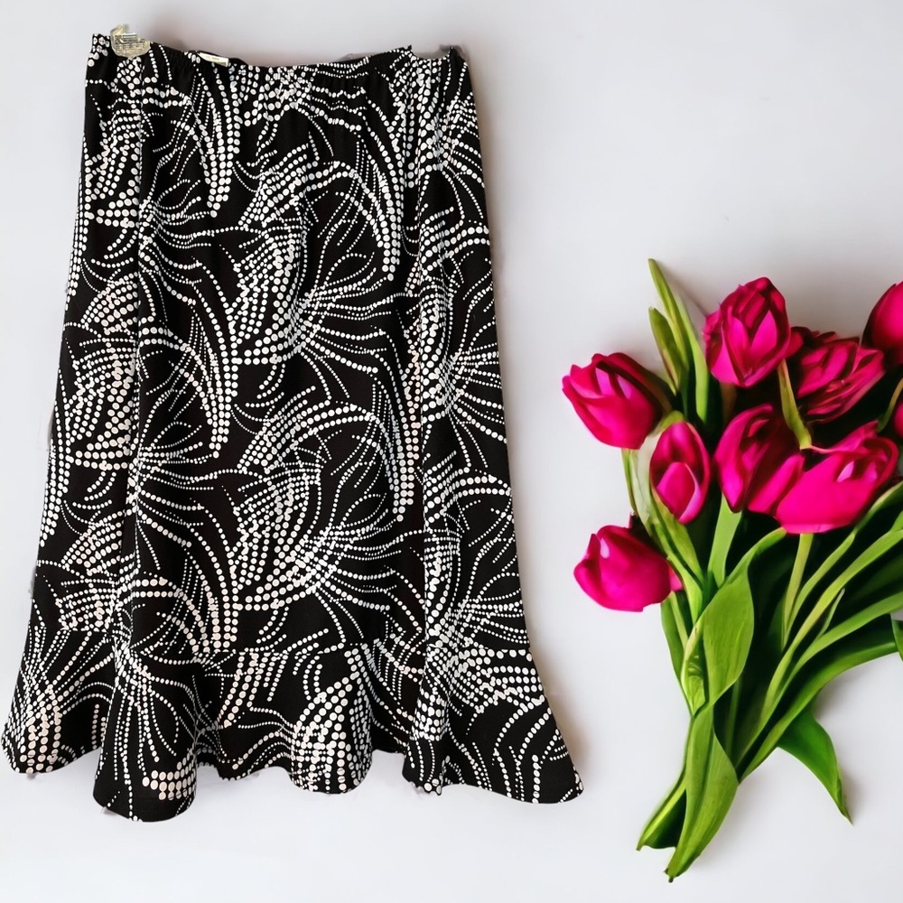 Size small stretch skirt with black and white dot pattern and ruffle hem